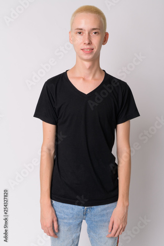 Portrait of happy young handsome androgynous man smiling © Ranta Images