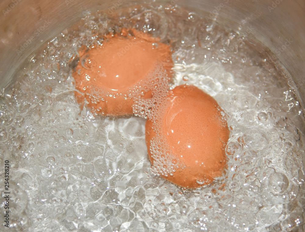 Fototapeta premium Boiled water eggs / To boil an egg in hot pot