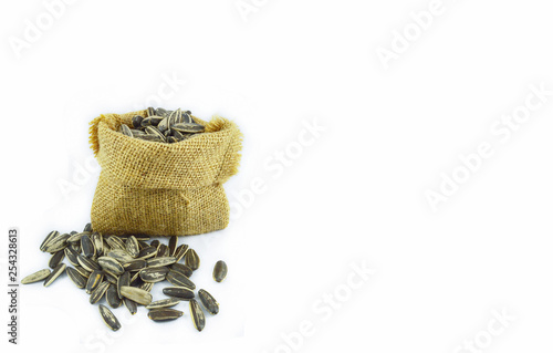 Sunflower seeds in sack for snack isolated on white background