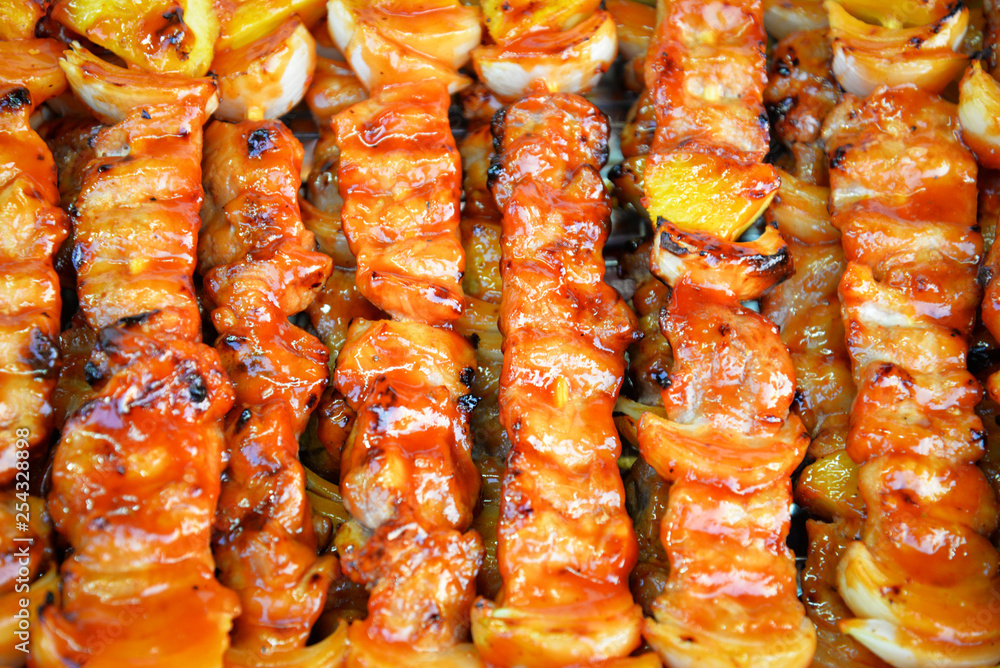 Barbecue grilled assorted sweet savory delicious with meat pork vegetables and fruit on grill BBQ.