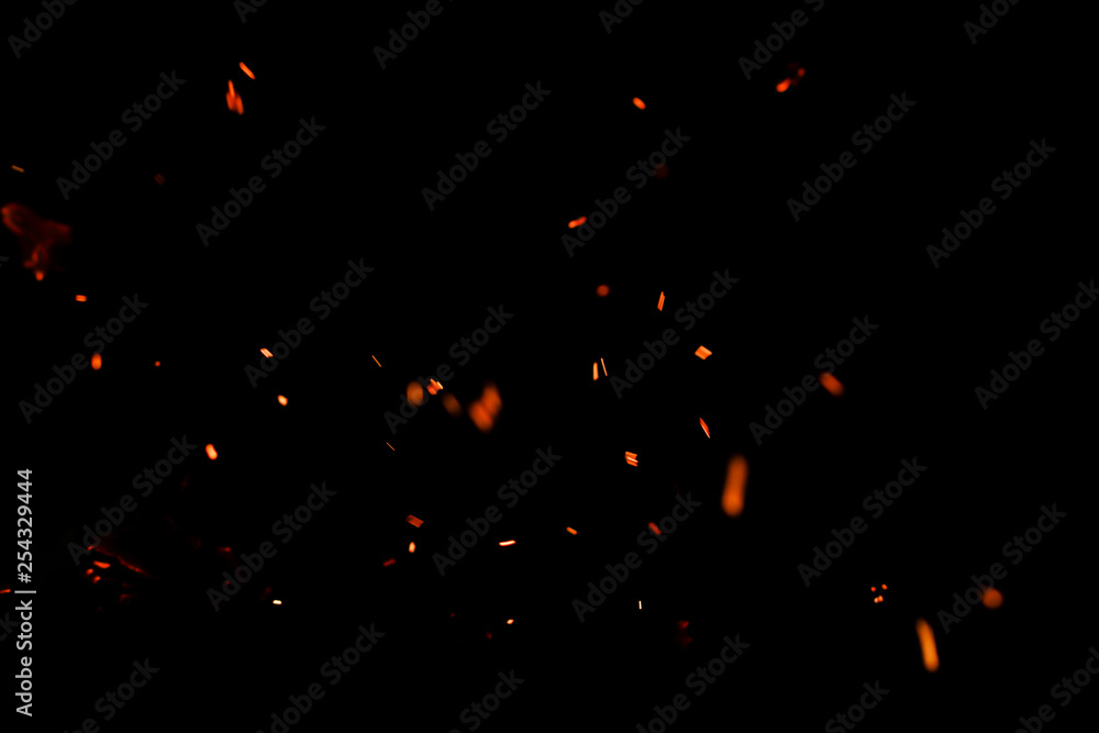 flame of fire with sparks on a black background flame of fire with sparks on a black background