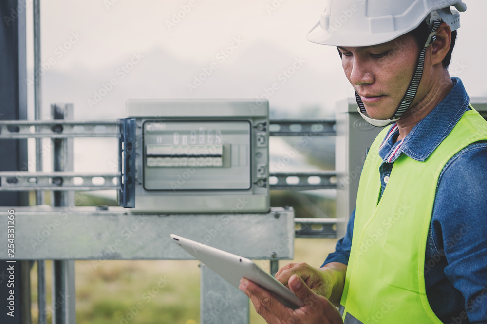 engineer or electrician inspect and checking solar equipment ;smart technology for operation of solar power plant by smart operator engineer or electrician inspect and checking solar equipment ;smart technology for operation of solar power plant by smart operator