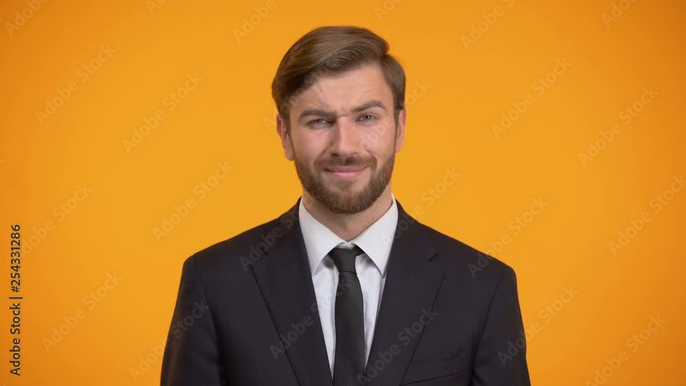 Disappointed office worker doing face palm gesture, orange background, problem Disappointed office worker doing face palm gesture, orange background, problem