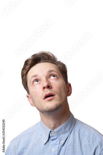handsome brunette male with pensive expression, dressed in fashionable shirt, tries to remember something, isolated over white background with copy space for your promotional text