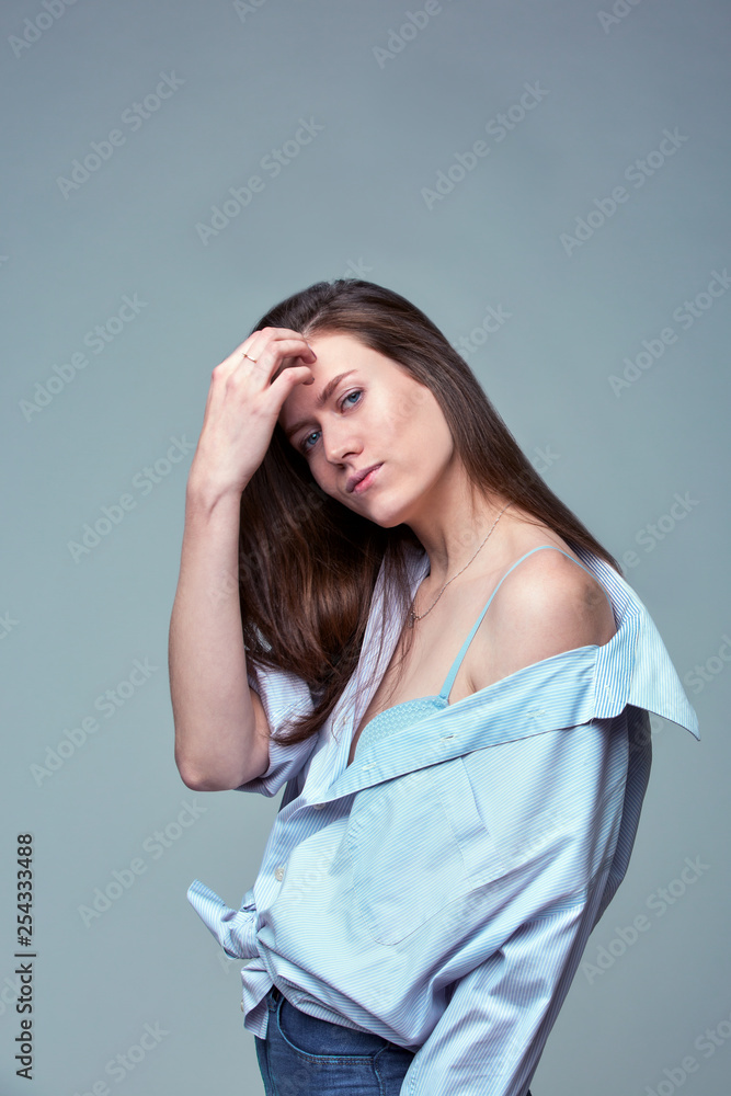beautiful girl with blue eyes posing over gray background beautiful girl with blue eyes posing over gray background