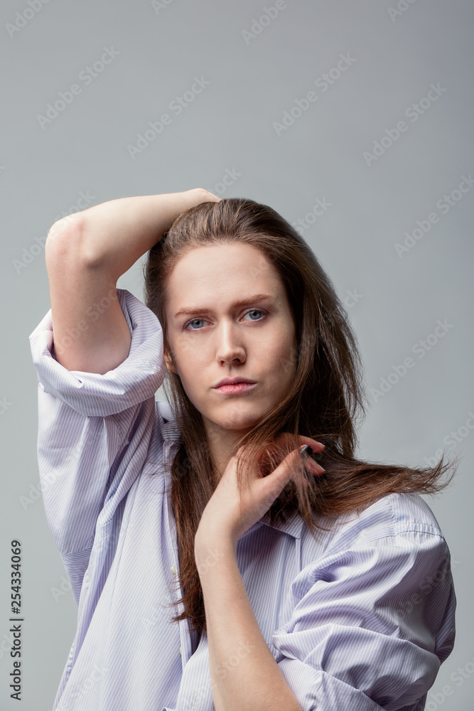 beautiful girl with blue eyes posing over gray background beautiful girl with blue eyes posing over gray background