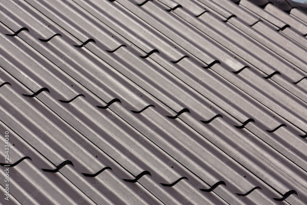 black roof tile top on residential house black roof tile top on residential house