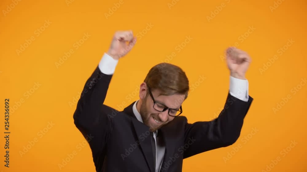Cheerful businessman dancing, celebrating successful deal, start up investment Cheerful businessman dancing, celebrating successful deal, start up investment