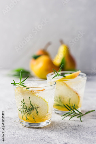 Summer drinks, rosemary pear cocktails. Selective focus, space for text.