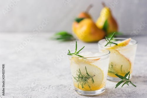 Summer drinks, rosemary pear cocktails. Selective focus, space for text.