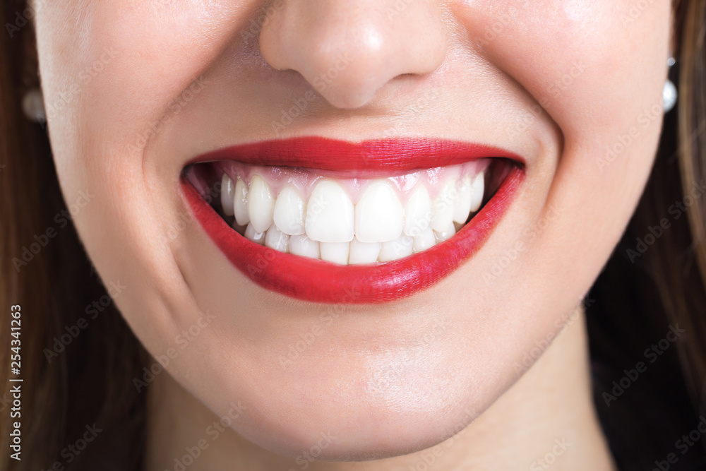 Close-up of smile with white healthy teeth.Concept Healthy lifestyle Close-up of smile with white healthy teeth.Concept Healthy lifestyle