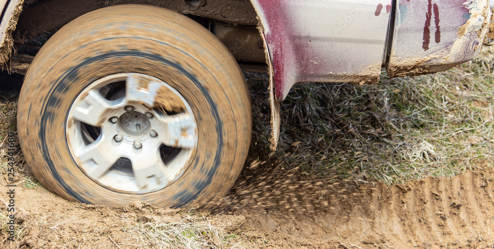 Car wheel slips in the dirt in nature Car wheel slips in the dirt in nature