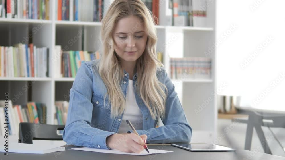 Young Woman Writing Letter at Work, Paperwork
