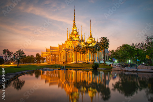 Beautiful temple thailand dramatic colorful sky twilight sunset shadow on water reflection