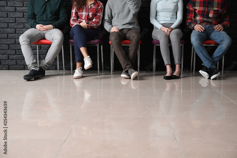 Young people waiting for job interview indoors