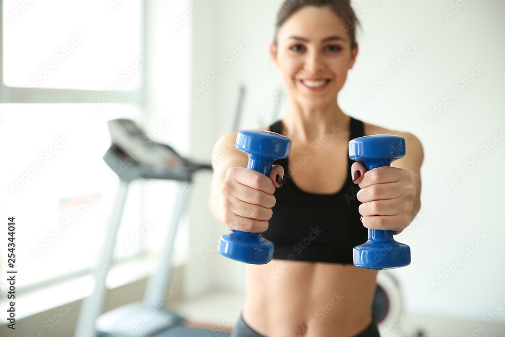 Sporty young woman training in gym Sporty young woman training in gym