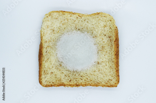 Monosodium glutamate (MSG) on slice breads isolated on white background.