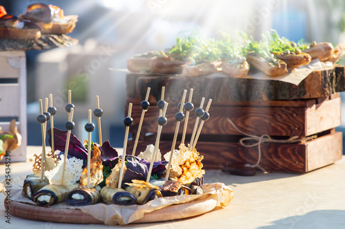 Fotografie Beautifully decorated catering banquet table with different food snacks and appe