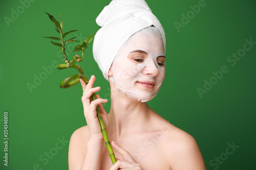 Woman with sheet facial mas...