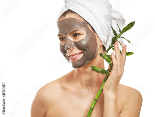 Woman with facial mask and ...