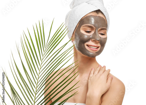 Woman with facial mask and ...