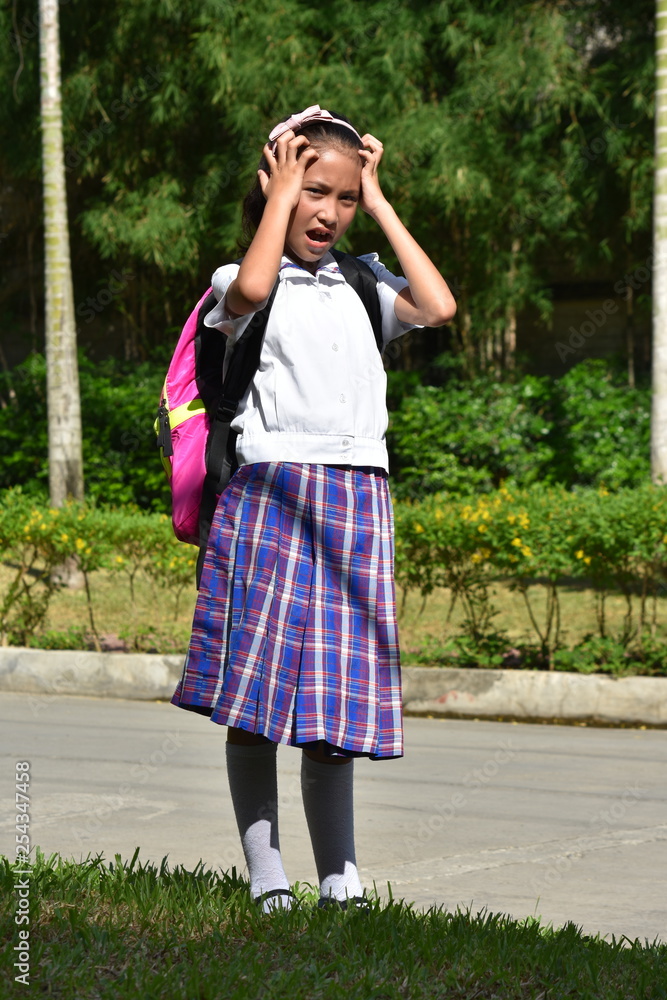 Young Asian Girl Student Under Stress Wearing School Uniform With Notebooks
