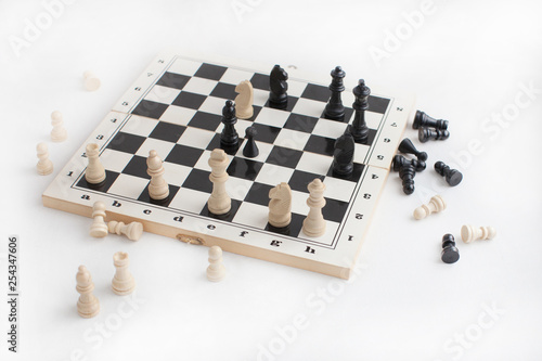 Chess board with chess figures on white background.