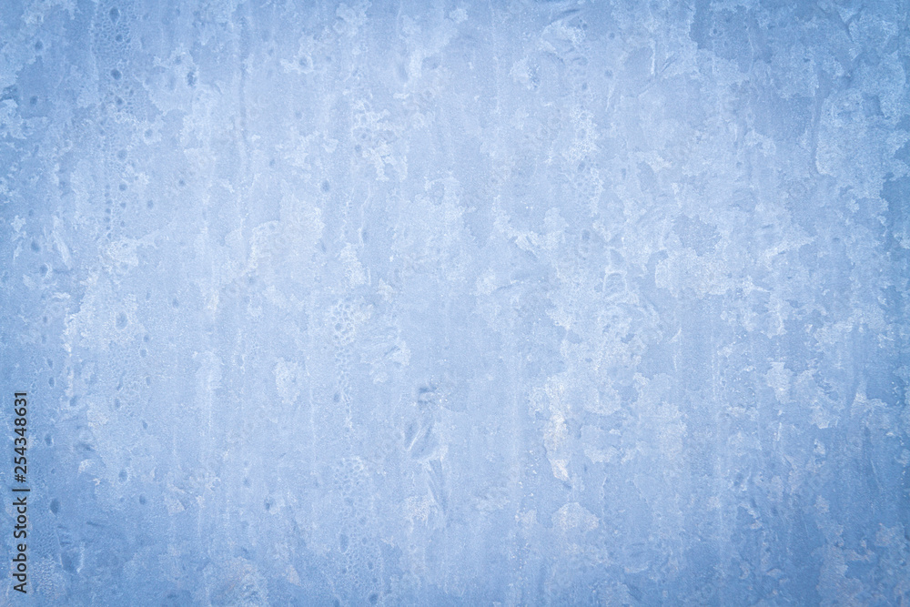 Fototapeta premium Frosty patterns on a frozen ice box in the early morning