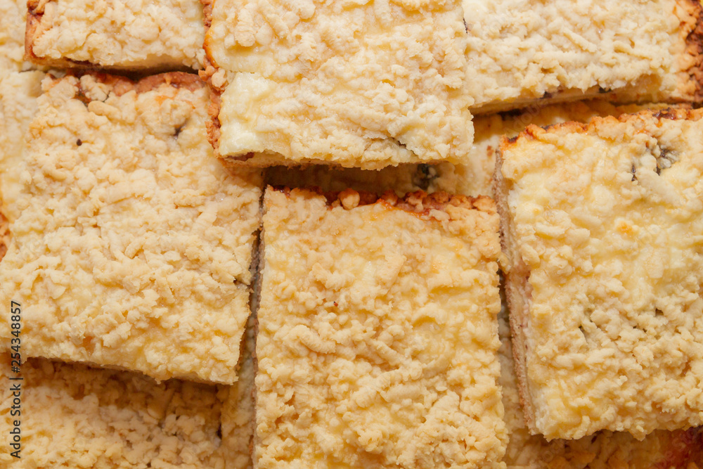 Freshly baked sand cake cut into pieces lie on top of each other Freshly baked sand cake cut into pieces lie on top of each other