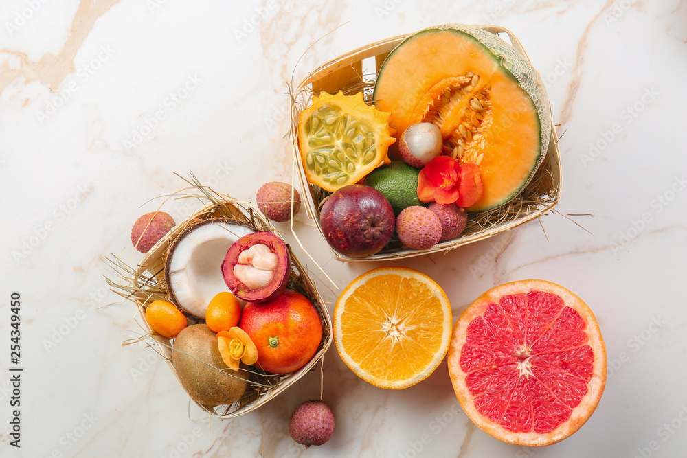Assortment of tasty exotic fruits on light background Assortment of tasty exotic fruits on light background