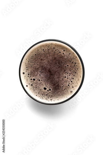 Glass of fresh beer on white background, top view