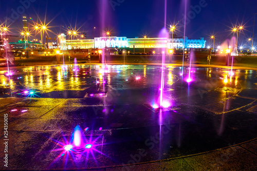 Colorful water fountain at Souq Waqif Park at Doha Corniche illuminated at night. Famous tourist attraction in Doha. Qatar, Middle East, Arabian Peninsula in Persian Gulf.