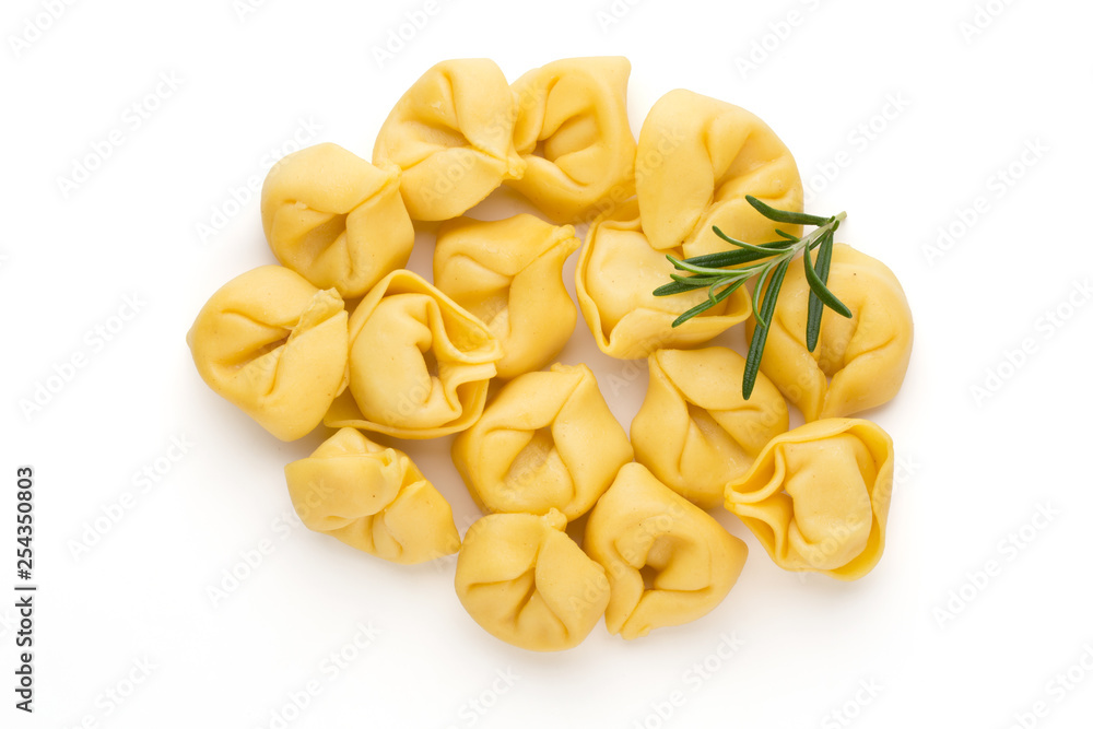 Raw homemade pasta,tortellini with herbs.