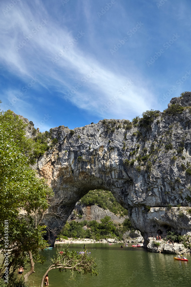 The Pont d'Arc is a natural stone arch in the Ardeche Gorges, France, Europe. Mountain river in European Grand Canyon. Sunny summer day