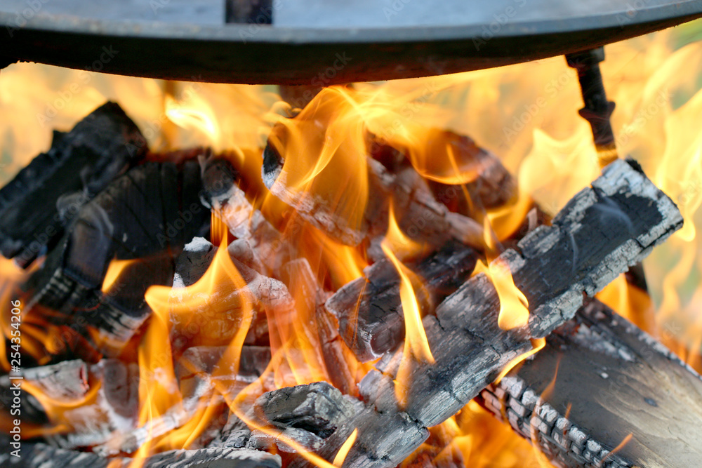 cooking on open fire, fry on a frying pan cooking on open fire, fry on a frying pan