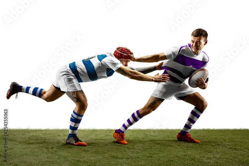 The silhouette of two caucasian rugby male players isolated on white background. Studio shot of fit men in motion or movement with ball. Jump and action concept. An incredible strain of all forces. © master1305