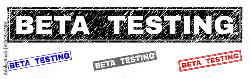 Grunge BETA TESTING rectangle stamp seals isolated on a white background. Rectangular seals with grunge texture in red, blue, black and gray colors.