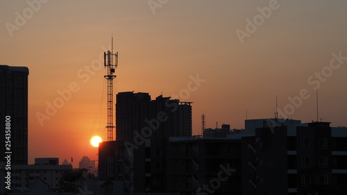 silhouette of city at sunset