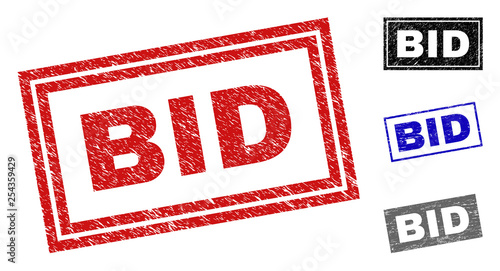 Grunge BID rectangle stamp seals isolated on a white background. Rectangular seals with grunge texture in red, blue, black and gray colors.