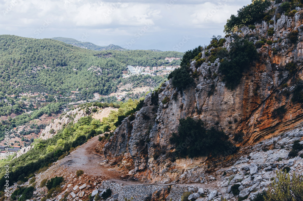Curve road in high mountains along mediterranean coast, Oludeniz, Fethiye, Turkey