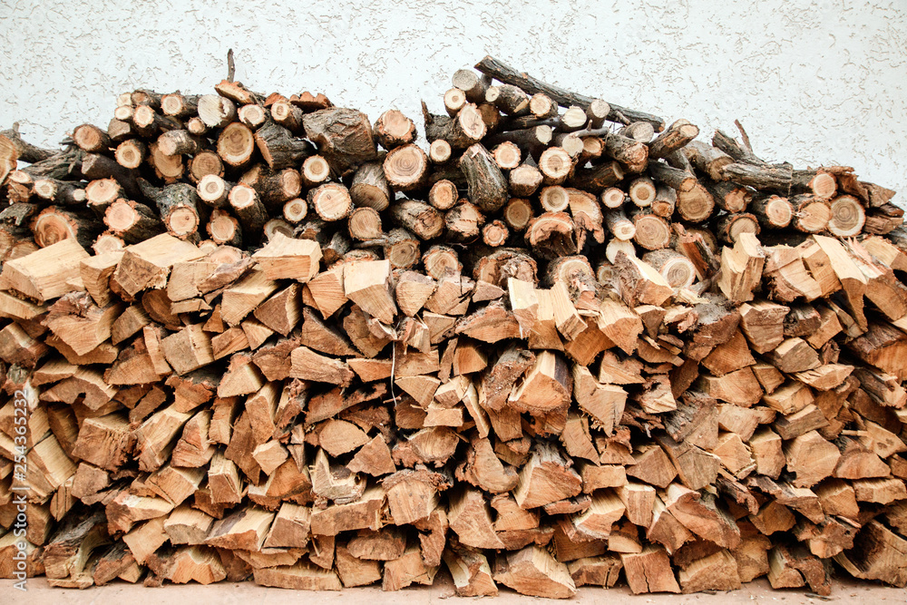 background of the wall of chopped firewoods background of the wall of chopped firewoods