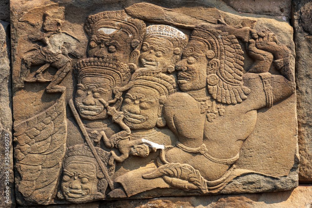 Relief of demons in Bakong temple, Cambodia Relief of demons in Bakong temple, Cambodia