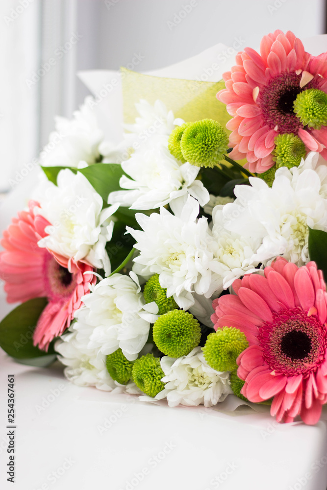 Bouguet of red and white flowers on the window. Birthday, wedding. celebration, summer and spring, floral concept Bouguet of red and white flowers on the window. Birthday, wedding. celebration, summer and spring, floral concept