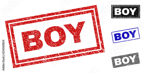 Grunge BOY rectangle stamp seals isolated on a white background. Rectangular seals with grunge texture in red, blue, black and gray colors. Vector rubber imprint of BOY label inside rectangle borders.