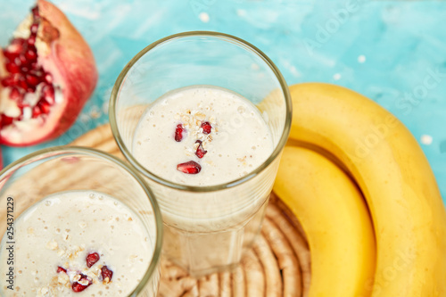 Smoothie with oat or oatmeal, banana and pomegranate