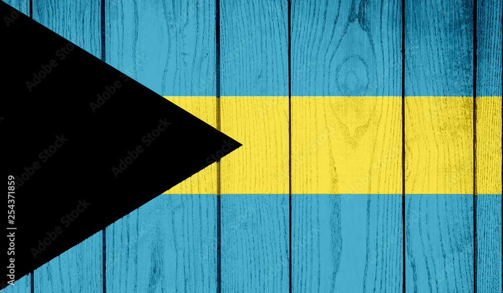 Naklejka premium Flag of The Bahamas on wooden background
