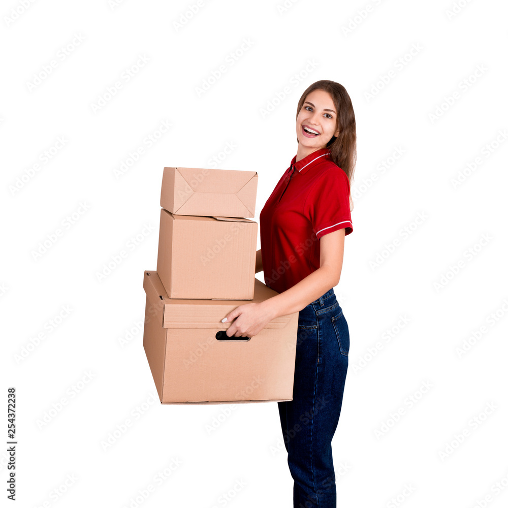 Pretty young woman loves her job. Delivery girl is holding a heap of boxes isolated on white background Pretty young woman loves her job. Delivery girl is holding a heap of boxes isolated on white background