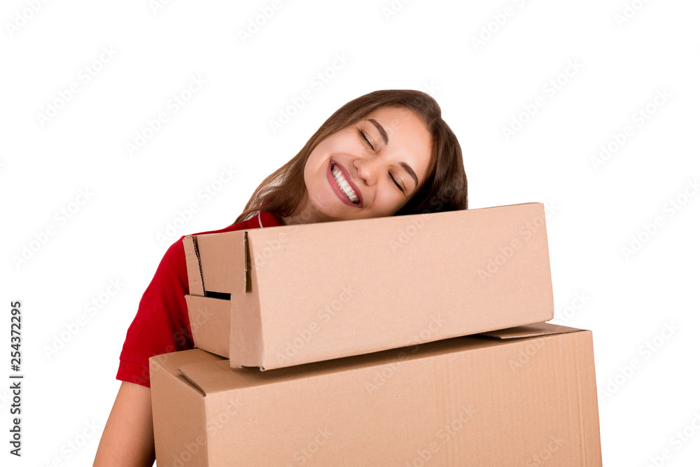 Pretty young woman loves her job. Delivery girl is holding a heap of boxes isolated on white background Pretty young woman loves her job. Delivery girl is holding a heap of boxes isolated on white background
