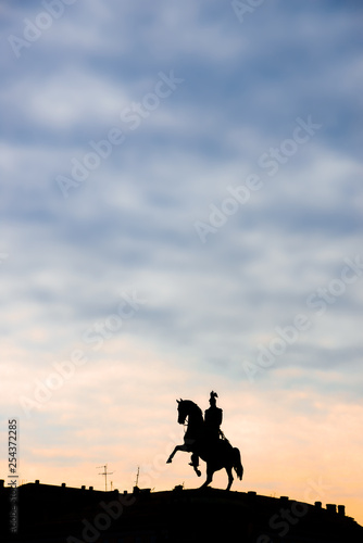 Monument to Tsar Nicholas I in St. Petersburg on St. Isaac s Square. Silhouette at sunrise. Free space for text. Copy space for text