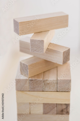 Wood block tower game on white background